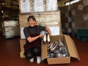 Lydia Stringer, trainee account manager, with some of the shoes