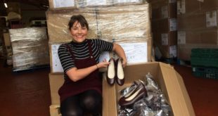 Lydia Stringer Trainee Account Manager at ICW Incorporatewear delivers 1,300 pairs of shoes to schoolgirls in need