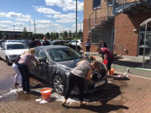 The team washed cars for CRUK