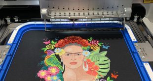 A printed image being embroidered