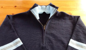 Quarter zip sweater with stripes in sleeves Very much a bespoke manufacturer