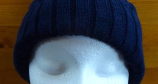 Rib cable hat with faux fur bobble and fleece lining 2 Add a matching knitted scarf, hat or beanie to your uniform range