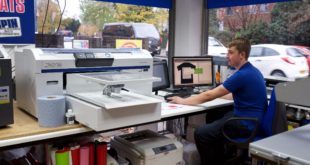 Sam Burton SE Workwear setting up a T shirt job on the Epson SureColor SC F2000 South East Workwear boosts business with Epson DTG printer