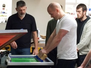 Douglas Grigar leads a screen printing class