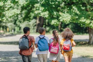 back view of four multicultural friends with backp 2024 11 19 06 09 09 utc Best practice for personalising backpacks and school bags