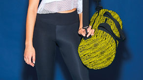bagbase bg196 fluorescent yellow black lifestyle 118482 web e1520330157910 New must-have barrel bag is inspired by trainers and right on-trend
