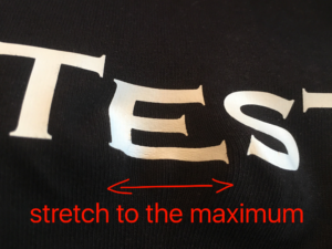 Stretch the test fabric to its maximum
