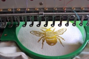 A close-up of the bee design on a bag
